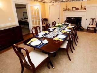 The inn dining room, a long table set for breakfast